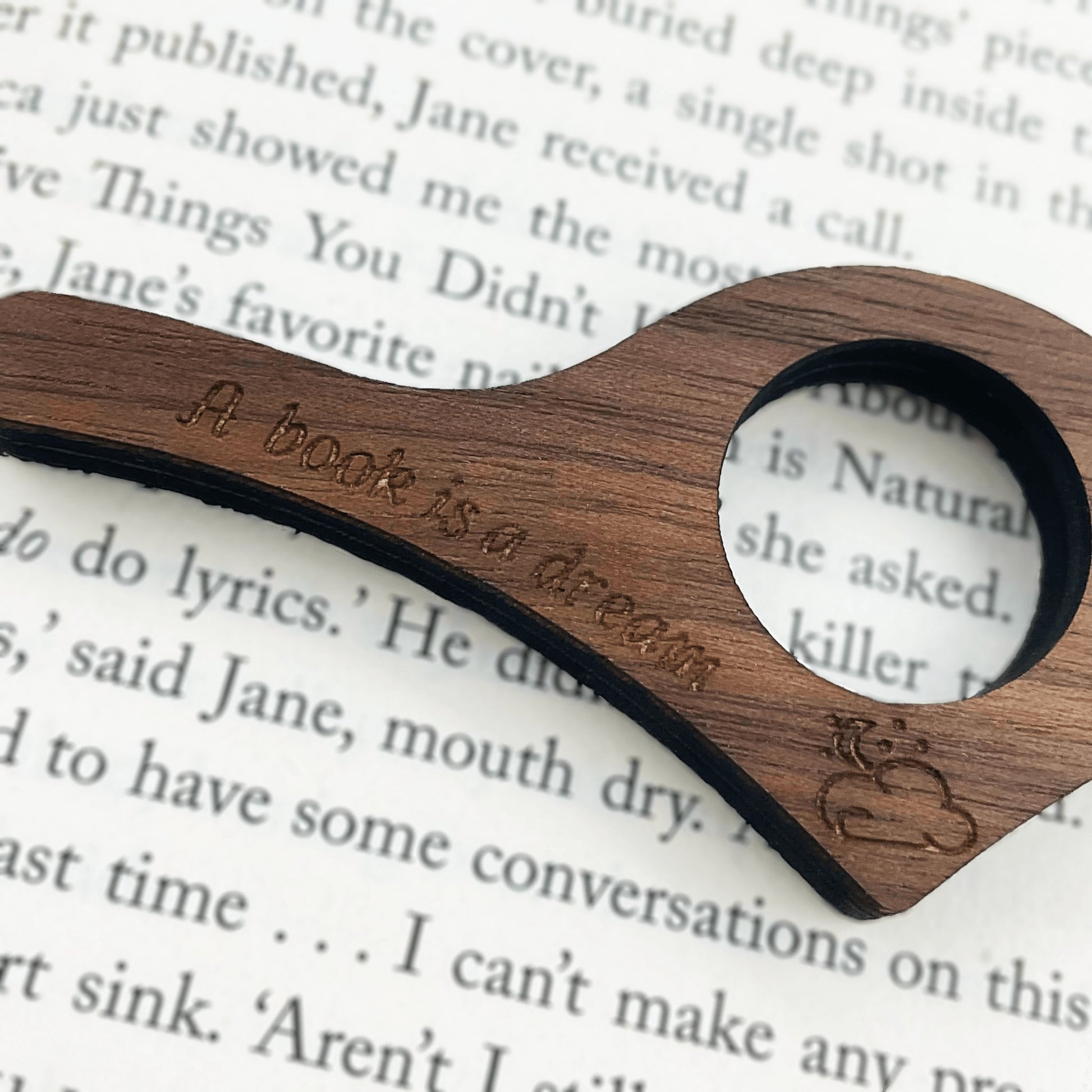 A Book Is A Dream Thumb Book Holder - Lost Minds Clothing